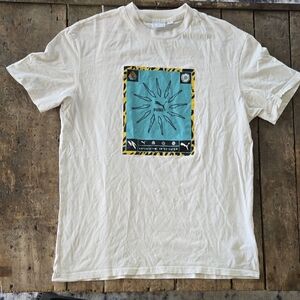 Puma White Short Sleeve Tee with Teal Graphic Panel and Yellow Accents